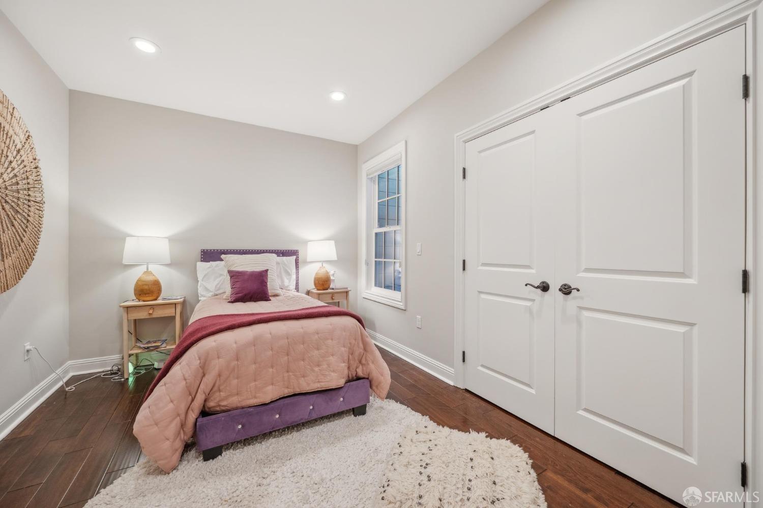 226 Roosevelt Way San Francisco, CA 94114 - Photo 38 of 65 a bedroom with a bed and wooden floor