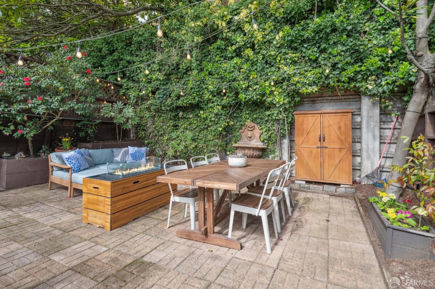 226 Roosevelt Way San Francisco, CA 94114 - Photo 57 of 65 a view of a chairs and table in the back yard of the house