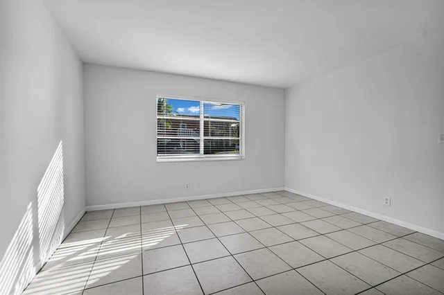 a view of an empty room and window