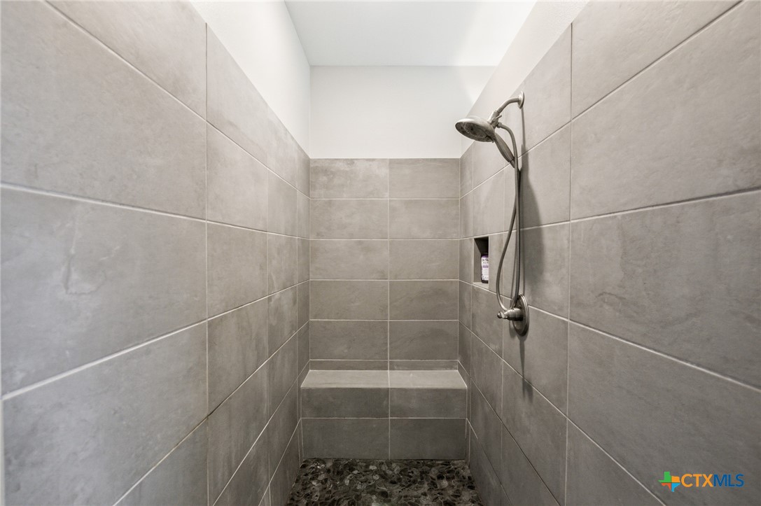 113 Terra Vista Ranch Road Victoria, TX 77904 - Photo 24 of 47 a bathroom with a glass door shower