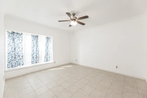 a bathroom with a granite countertop sink a toilet and bathtub