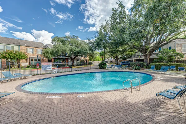 a view of a swimming pool with a patio