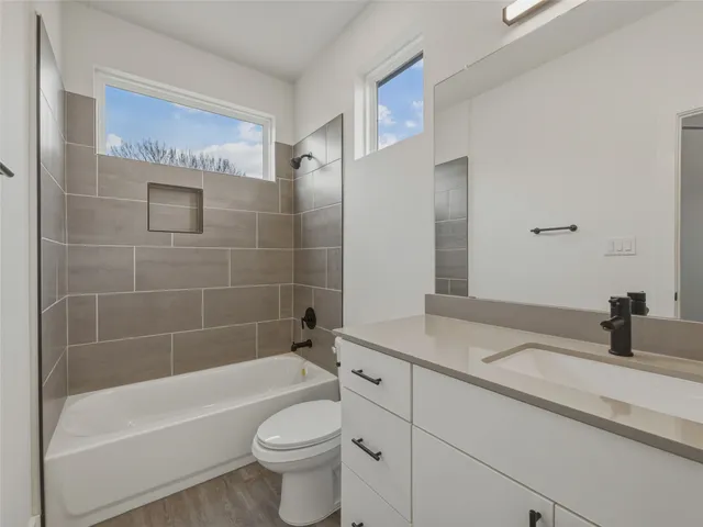a bathroom with a double vanity sink and mirror