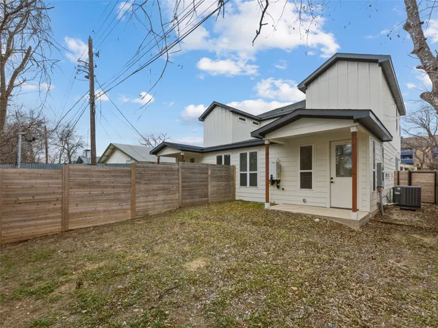 a spacious bathroom with double sink and mirror