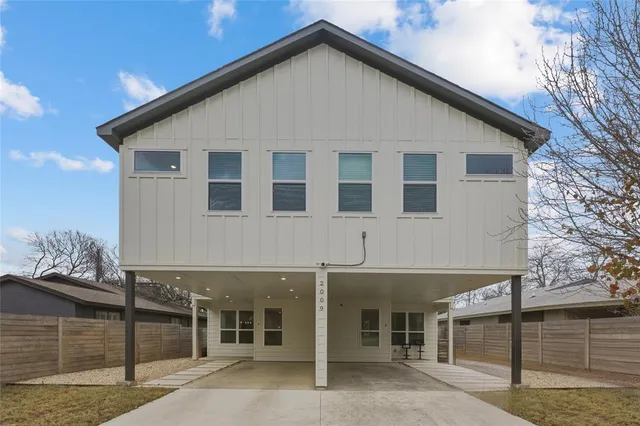 a view of a house with a fence