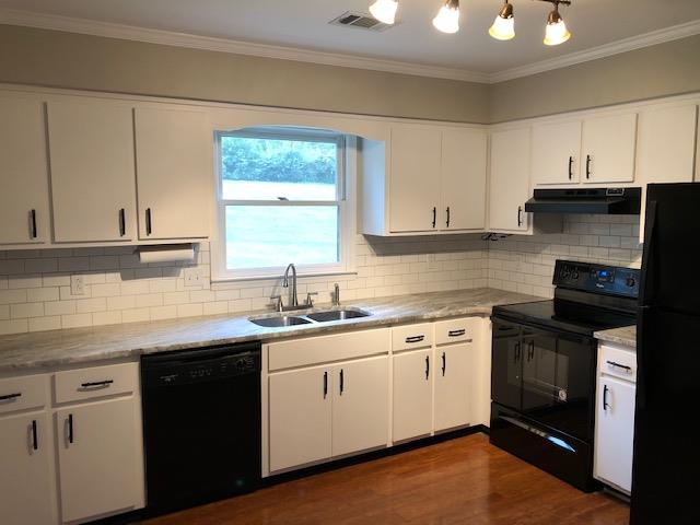721 Kent Road Nashville, TN 37214 - Photo 4 of 10 a kitchen with a sink stove and cabinets