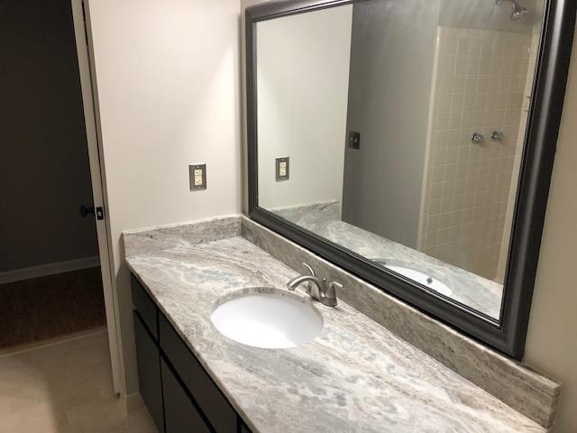721 Kent Road Nashville, TN 37214 - Photo 8 of 10 a bathroom with a granite countertop sink and a mirror