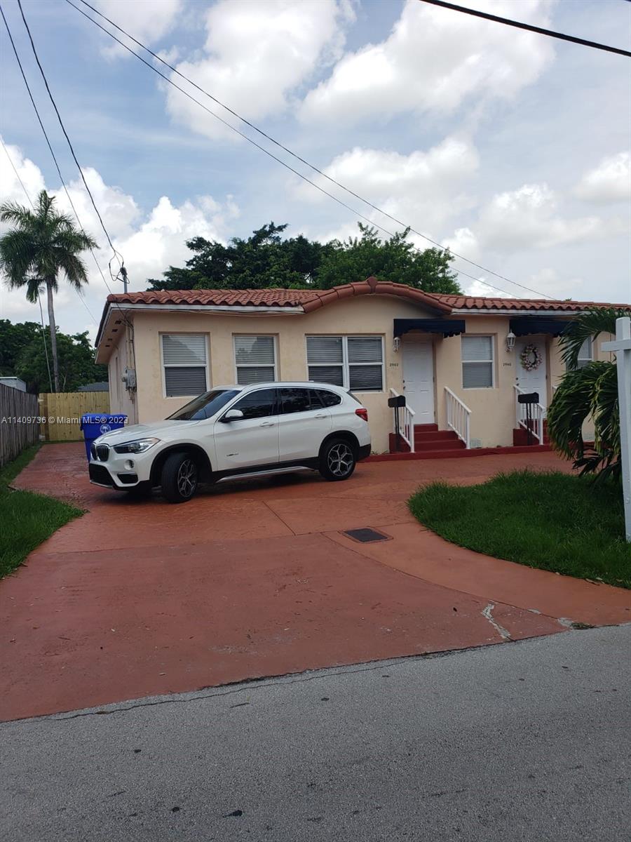 a car parked in front of a house
