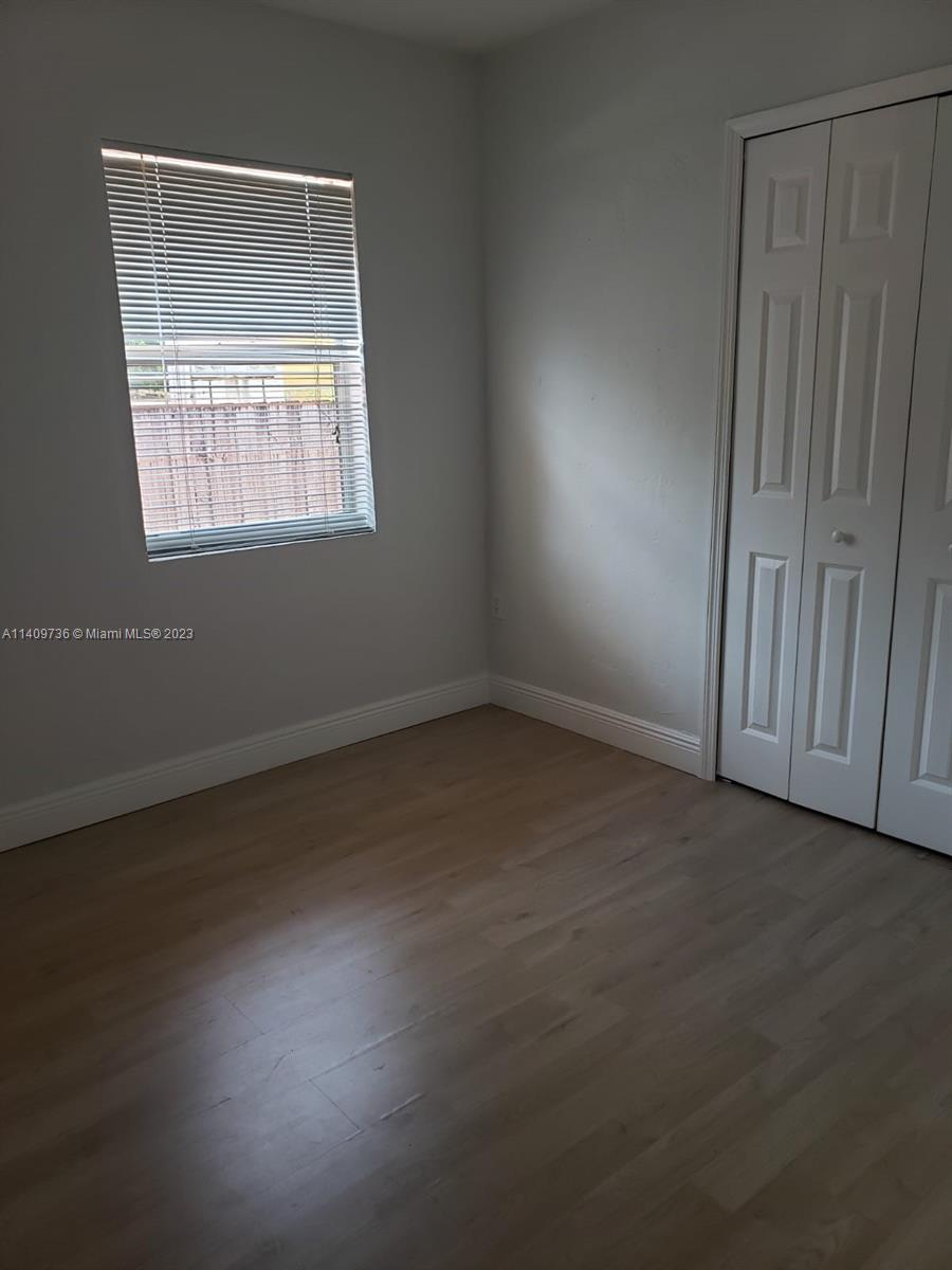 2940 Southwest 38th Court, Unit 2942 Miami, FL 33134 - Photo 8 of 10 an empty room with a window