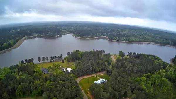 a view of a lake and a yard