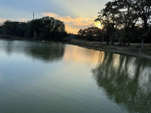 a view of a lake with an outdoor seating