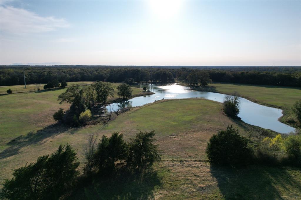 3827 County Road 3827 Wills Point, TX 75169 - Photo 7 of 25 a view of a lake with a yard