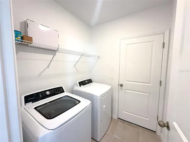 a utility room with dryer and washer