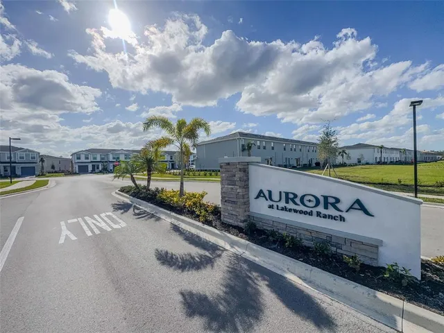 a view of a street with sign on the wall
