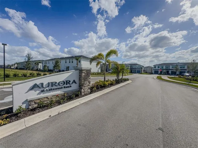 a view of a city street bridge and trees