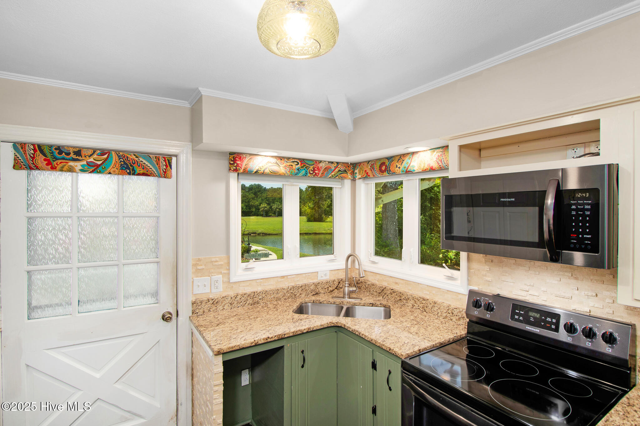 800 Country Club Road, Unit 33 HAYSTACKS Morehead City, NC 28557 - Photo 11 of 58 Cozy kitchen with views of the pond