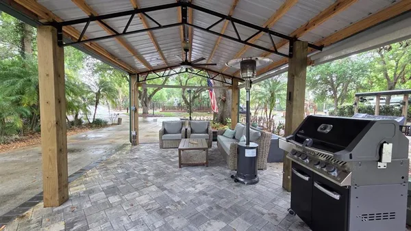 a view of a chairs and table in the porch