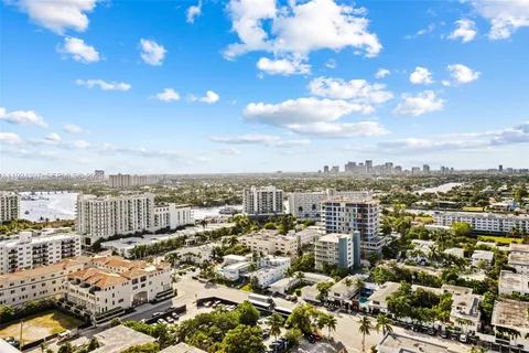 a living room with furniture flower pot and a fireplace