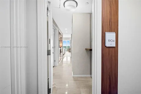 a kitchen with stainless steel appliances granite countertop a sink and a microwave
