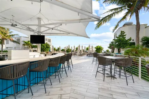 a terrace with outdoor seating and city view