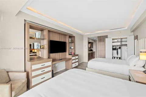 a bathroom with a granite countertop sink mirror and toilet