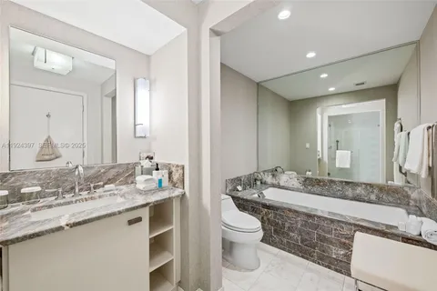 a view of a balcony with wooden floor and city view