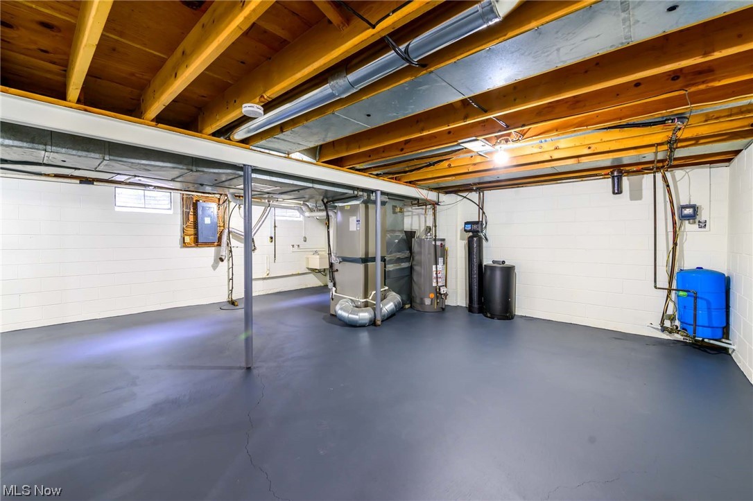 1820 Spring Valley Avenue Northwest Canton, OH 44708 - Photo 29 of 32 Basement with heating utilities and gas water heater