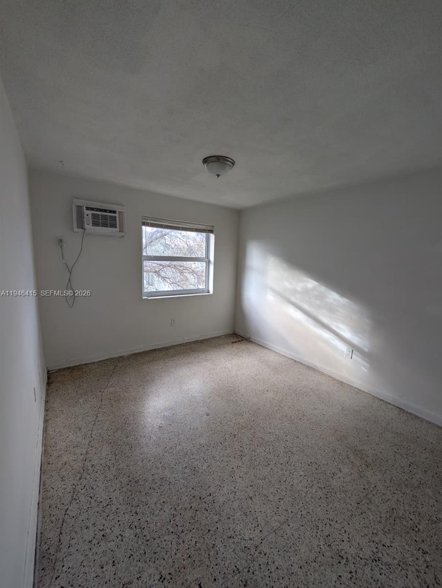 1461 Southwest 5th Street, Unit 4 Miami, FL 33135 - Photo 4 of 12 a view of empty room with window
