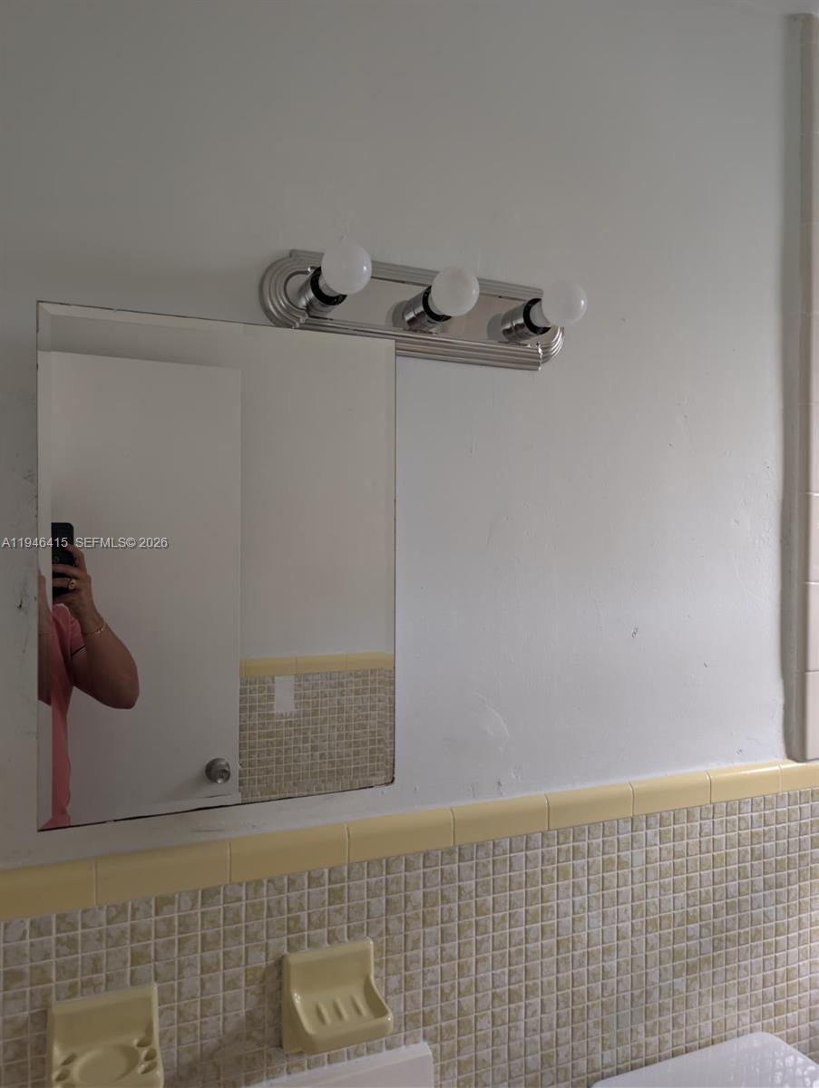 1461 Southwest 5th Street, Unit 4 Miami, FL 33135 - Photo 6 of 12 a bathroom with a shower