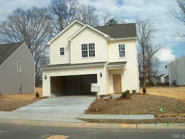 2821 Smooth Stone Trail Raleigh, NC 27610 - Photo 1 of 1 a front view of a house with a yard and garage