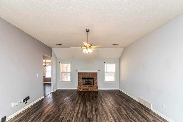 a view of livingroom with window fireplace and hardwood floor