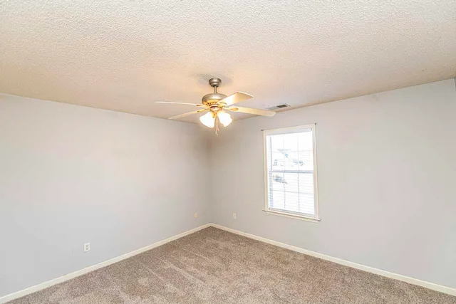 an empty room that has a window