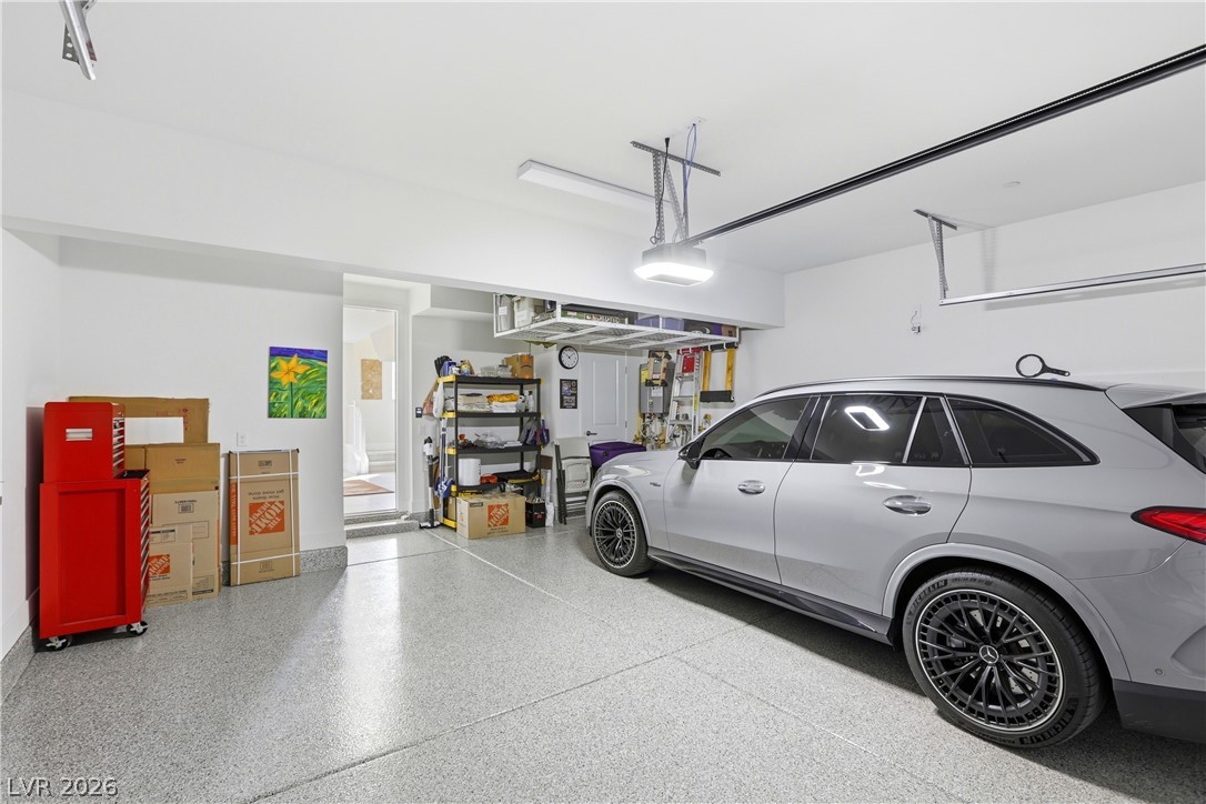 4159 Solace Street, Unit 2 Las Vegas, NV 89135 - Photo 49 of 71 Finished 2-car garage with overhead rack, water system and tankless water heater.