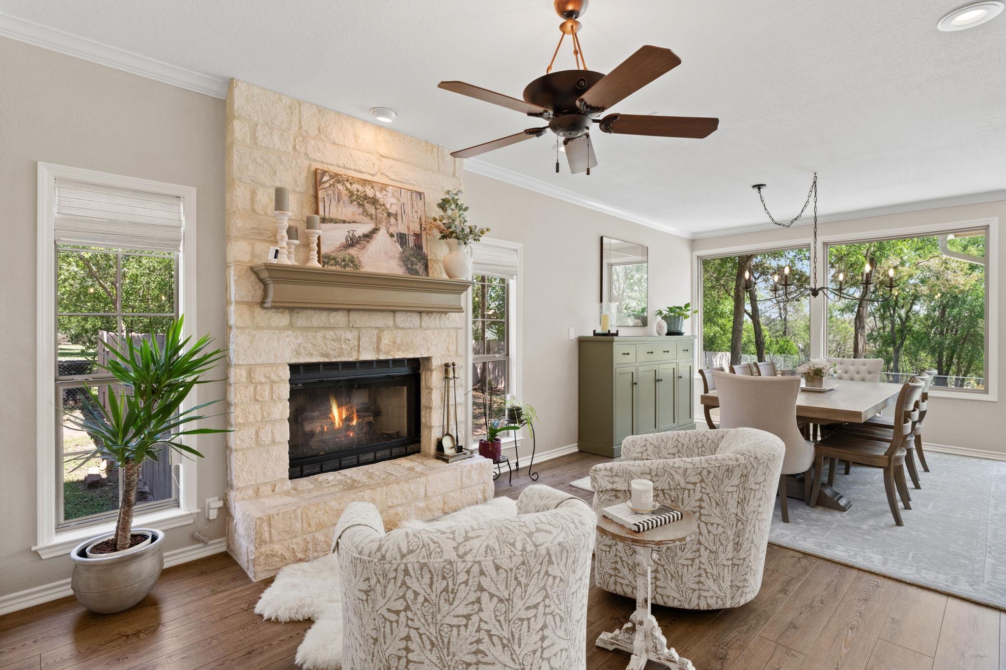 2409 Mormon Mill Road Marble Falls, TX 78654 - Photo 4 of 30 a living room with furniture a fireplace and a large window