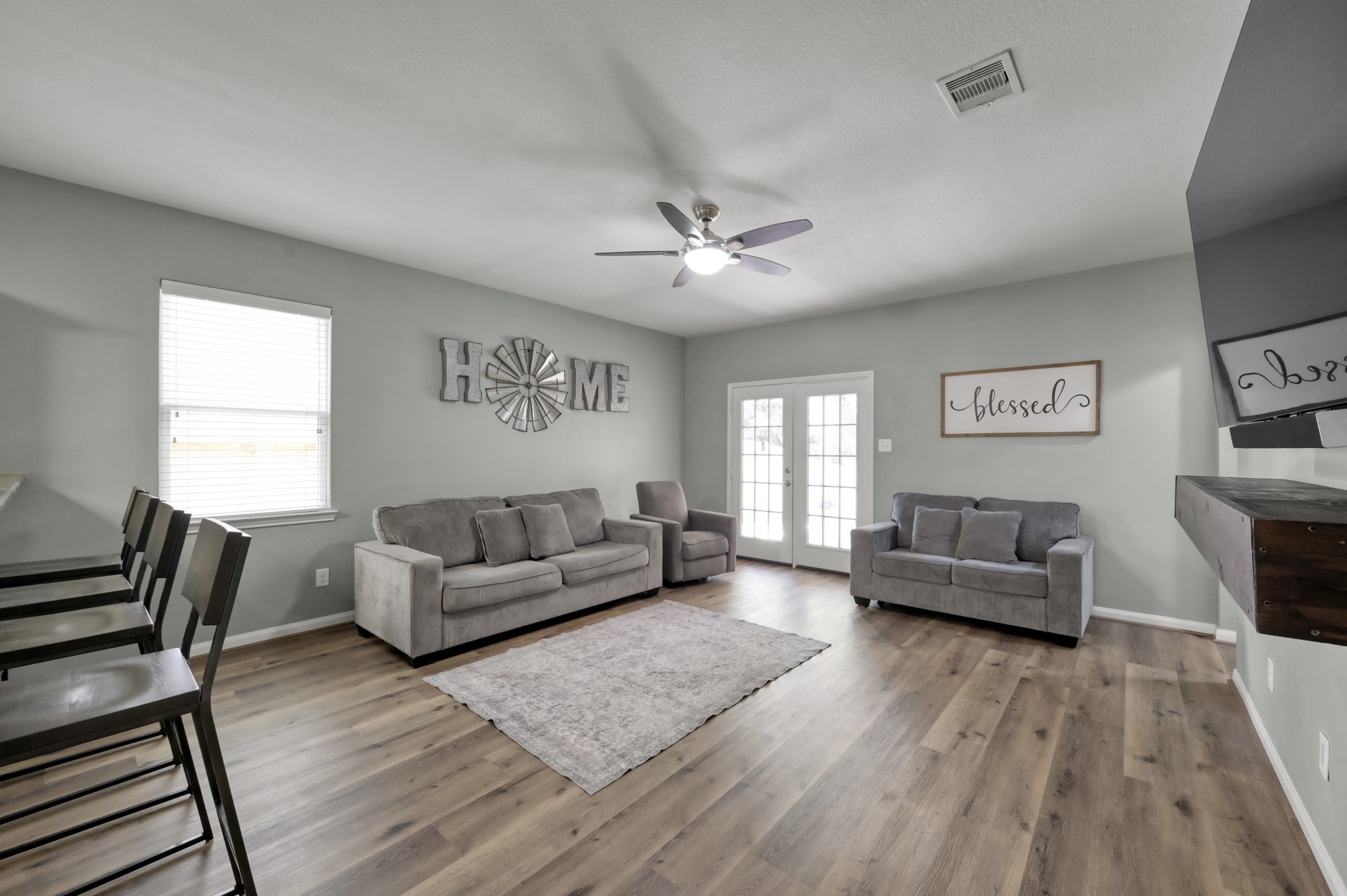 7562 Fettle Lane Conroe, TX 77304 - Photo 13 of 30 Spacious family room filled with natural light and comfortable gathering space.