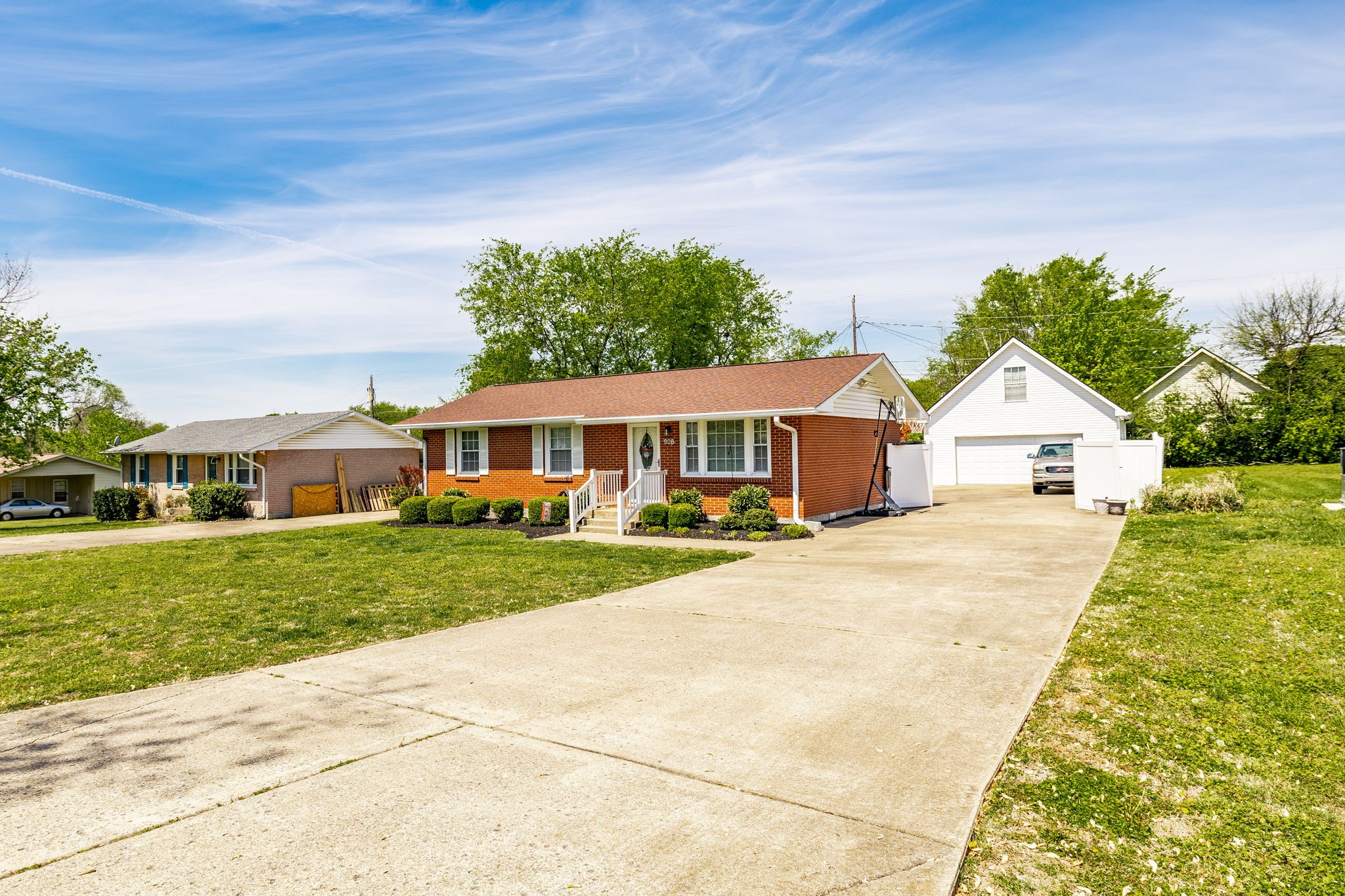 926 Hart Street Gallatin, TN 37066 - Photo 2 of 53 a front view of a house with a yard and trees