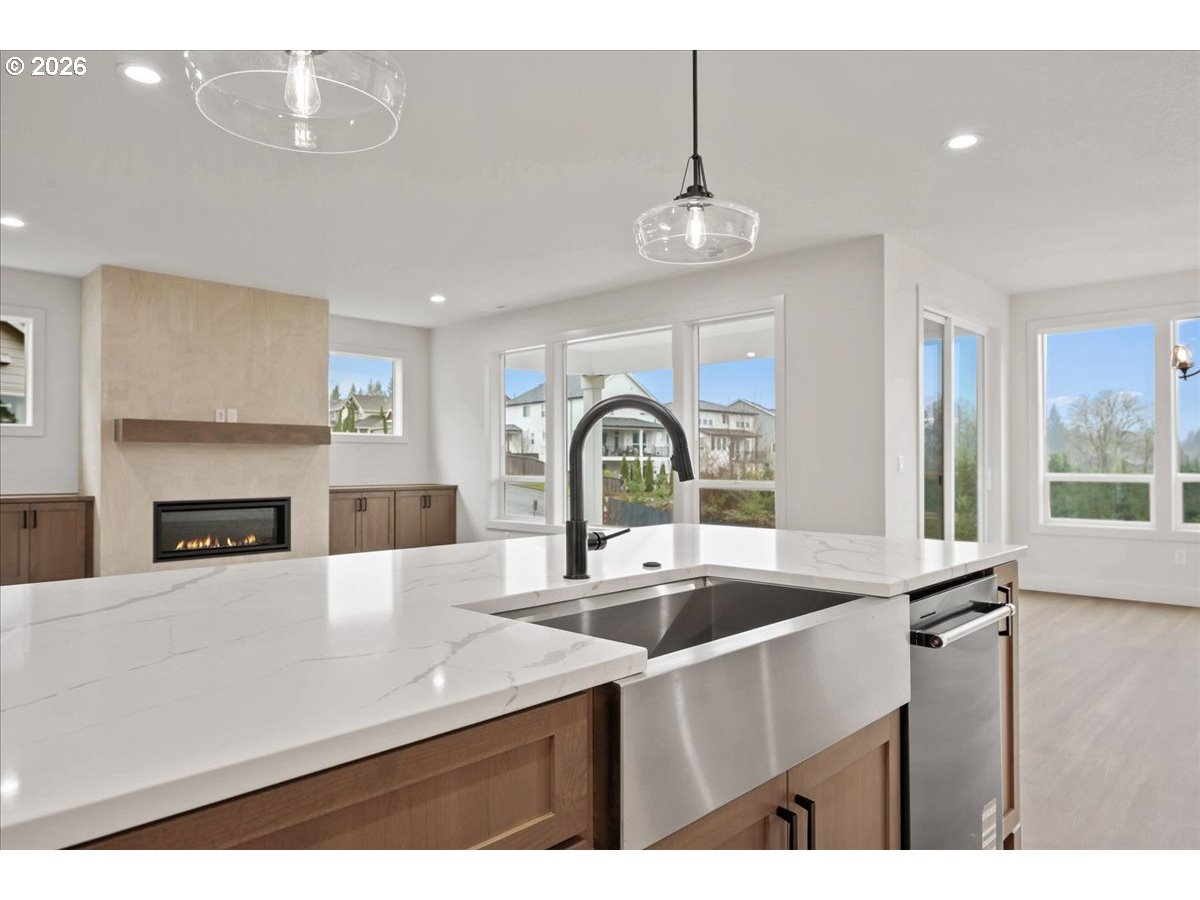 3509 North 11th Circle Ridgefield, WA 98642 - Photo 15 of 43 a kitchen with a sink a counter and appliances