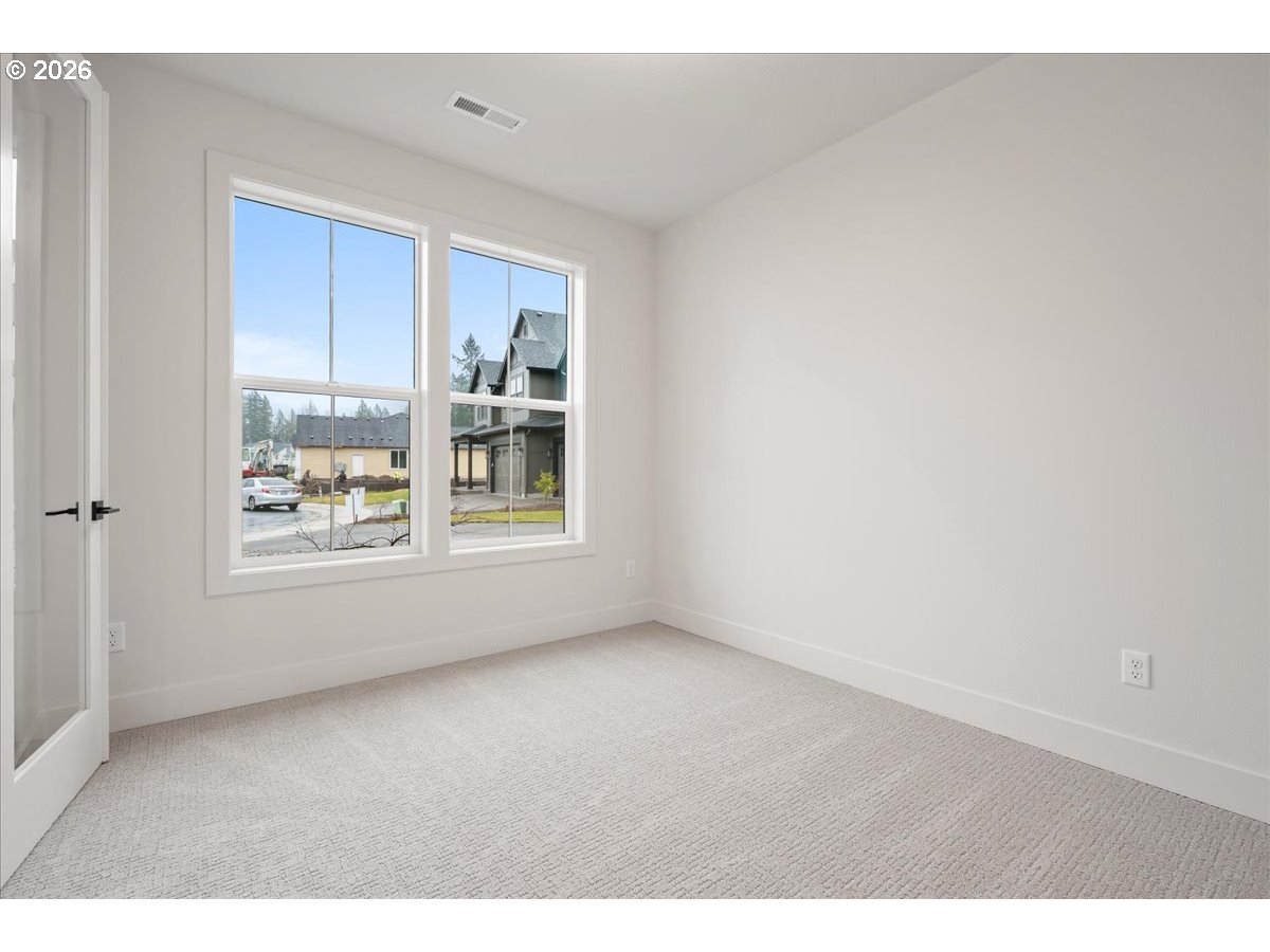 3509 North 11th Circle Ridgefield, WA 98642 - Photo 22 of 43 a view of an empty room with a window