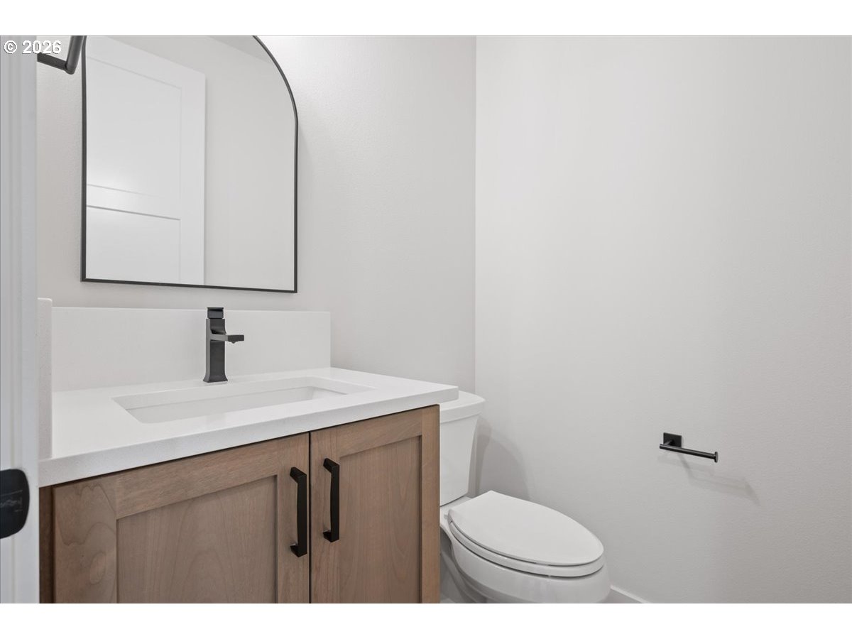 3509 North 11th Circle Ridgefield, WA 98642 - Photo 24 of 43 a bathroom with a sink and a toilet