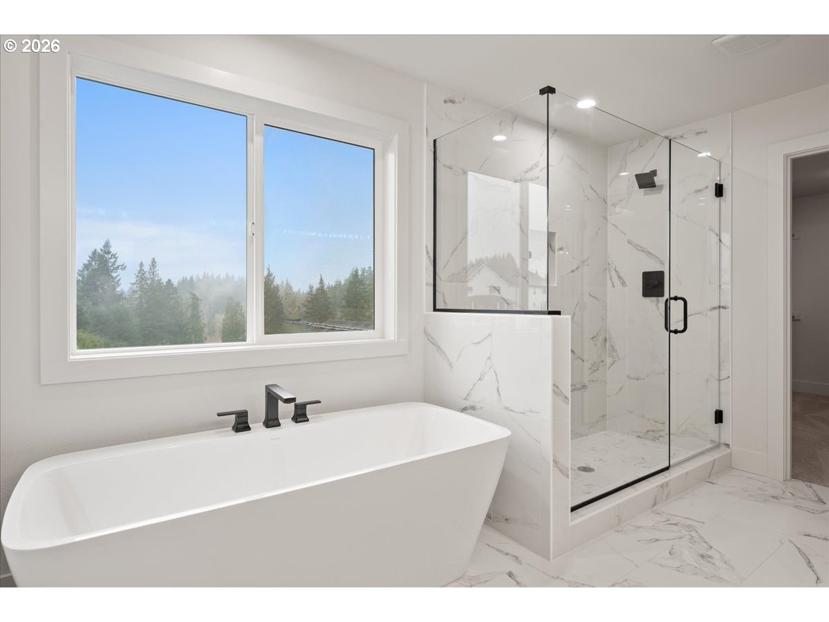 3509 North 11th Circle Ridgefield, WA 98642 - Photo 30 of 43 a bathroom with a bathtub and a sink