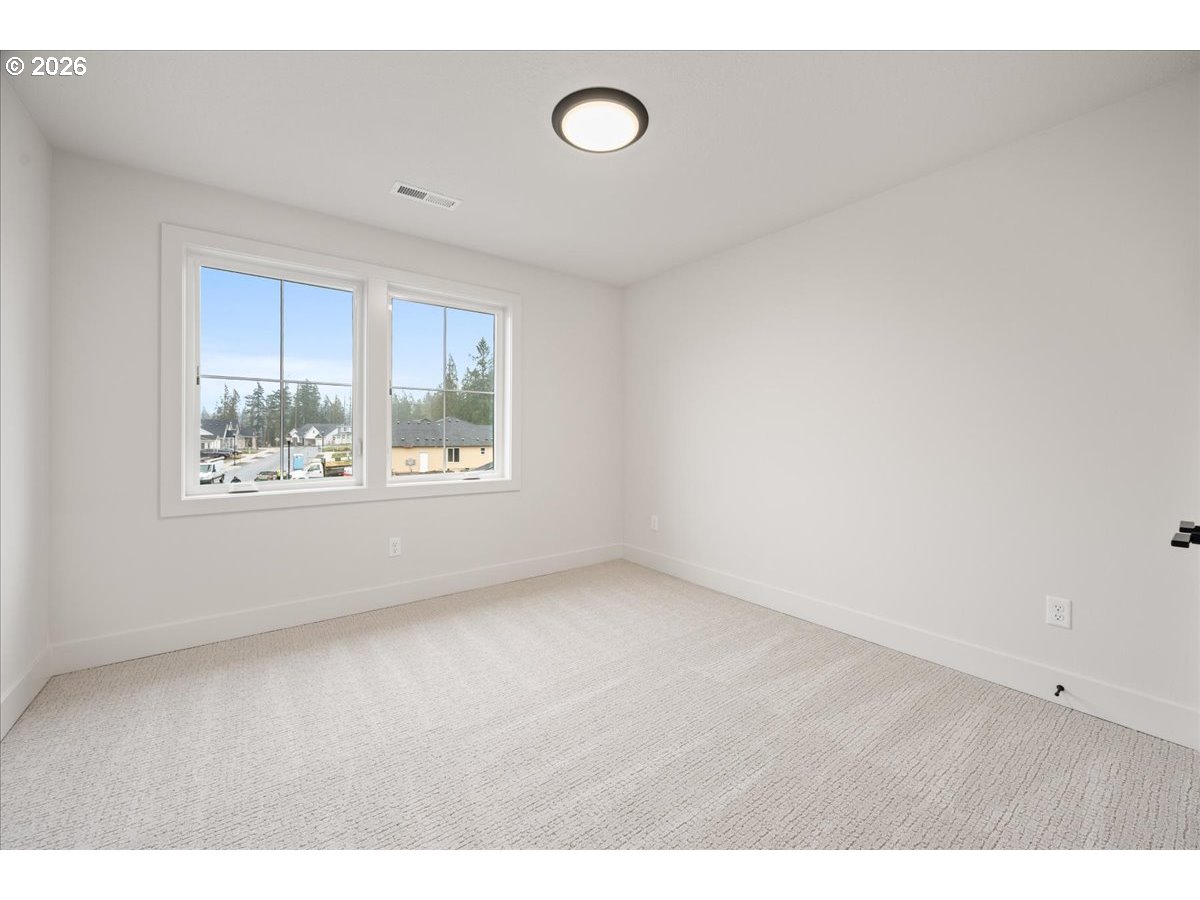 3509 North 11th Circle Ridgefield, WA 98642 - Photo 34 of 43 a view of an empty room with a window