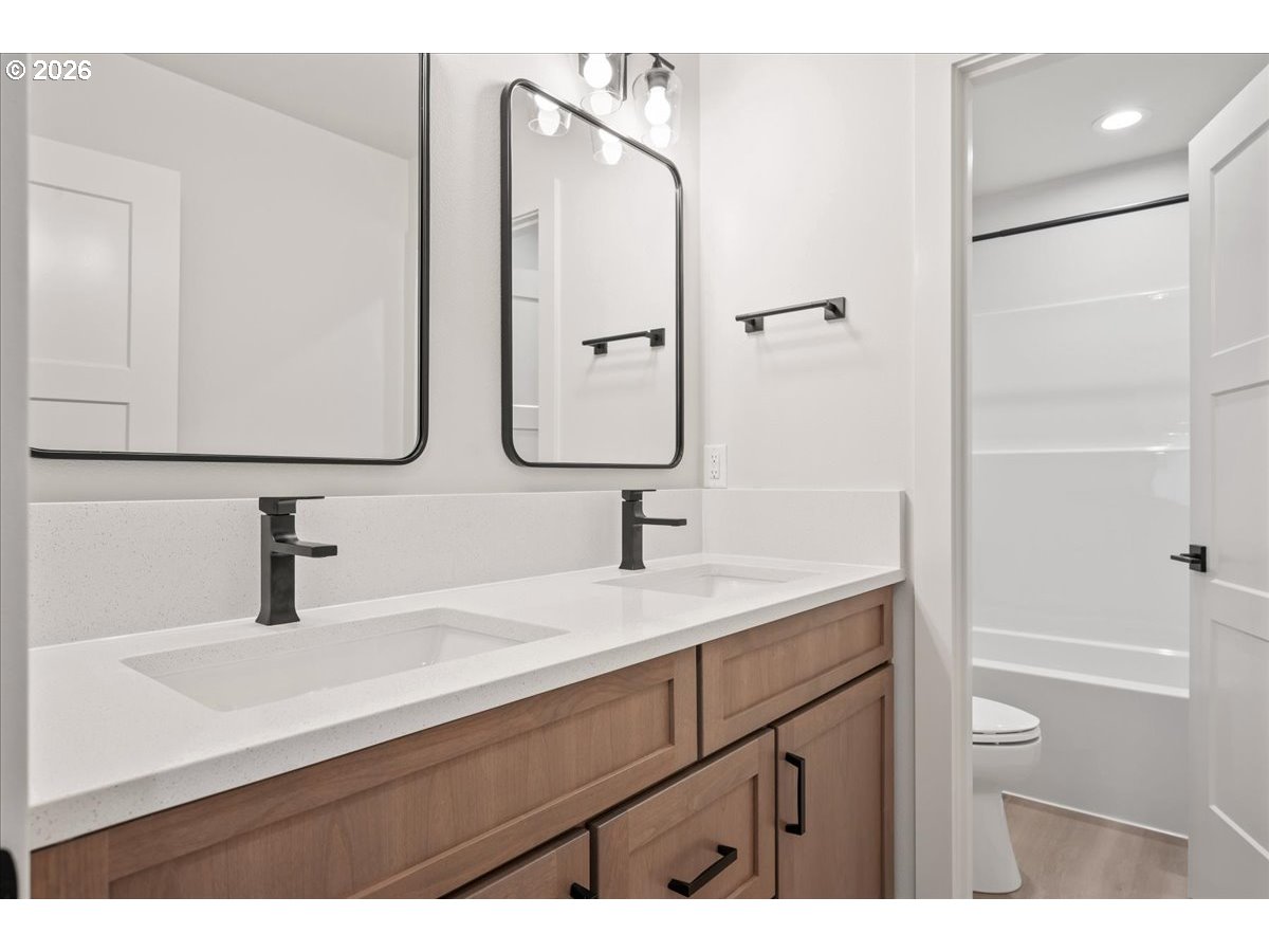 3509 North 11th Circle Ridgefield, WA 98642 - Photo 35 of 43 a bathroom with a sink and a mirror