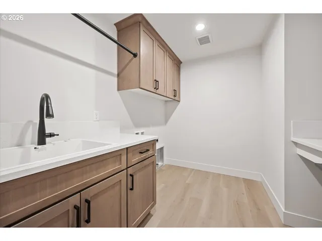 a view of a living room and kitchen with a large window