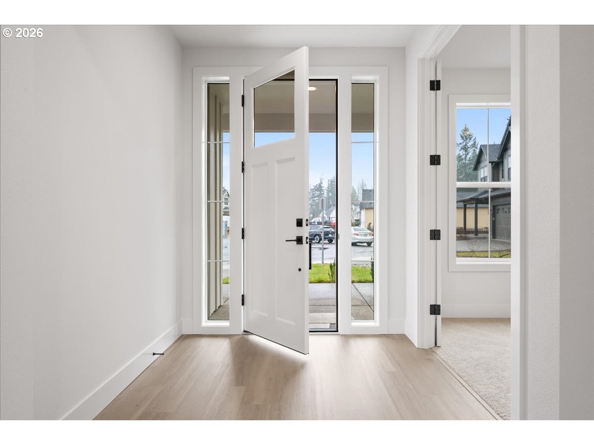 3509 North 11th Circle Ridgefield, WA 98642 - Photo 4 of 43 a view of an entryway with wooden floor