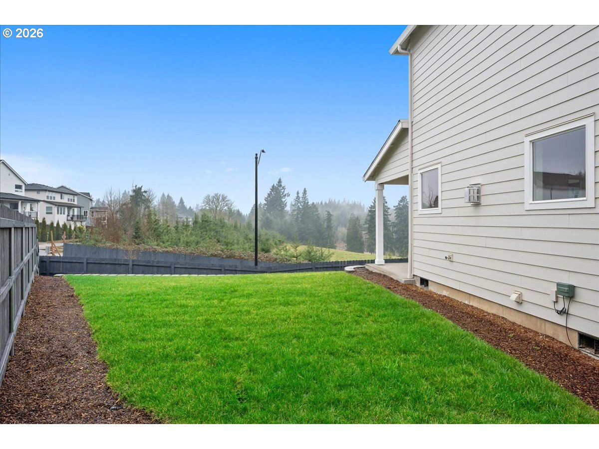 3509 North 11th Circle Ridgefield, WA 98642 - Photo 41 of 43 a view of a backyard with a garden