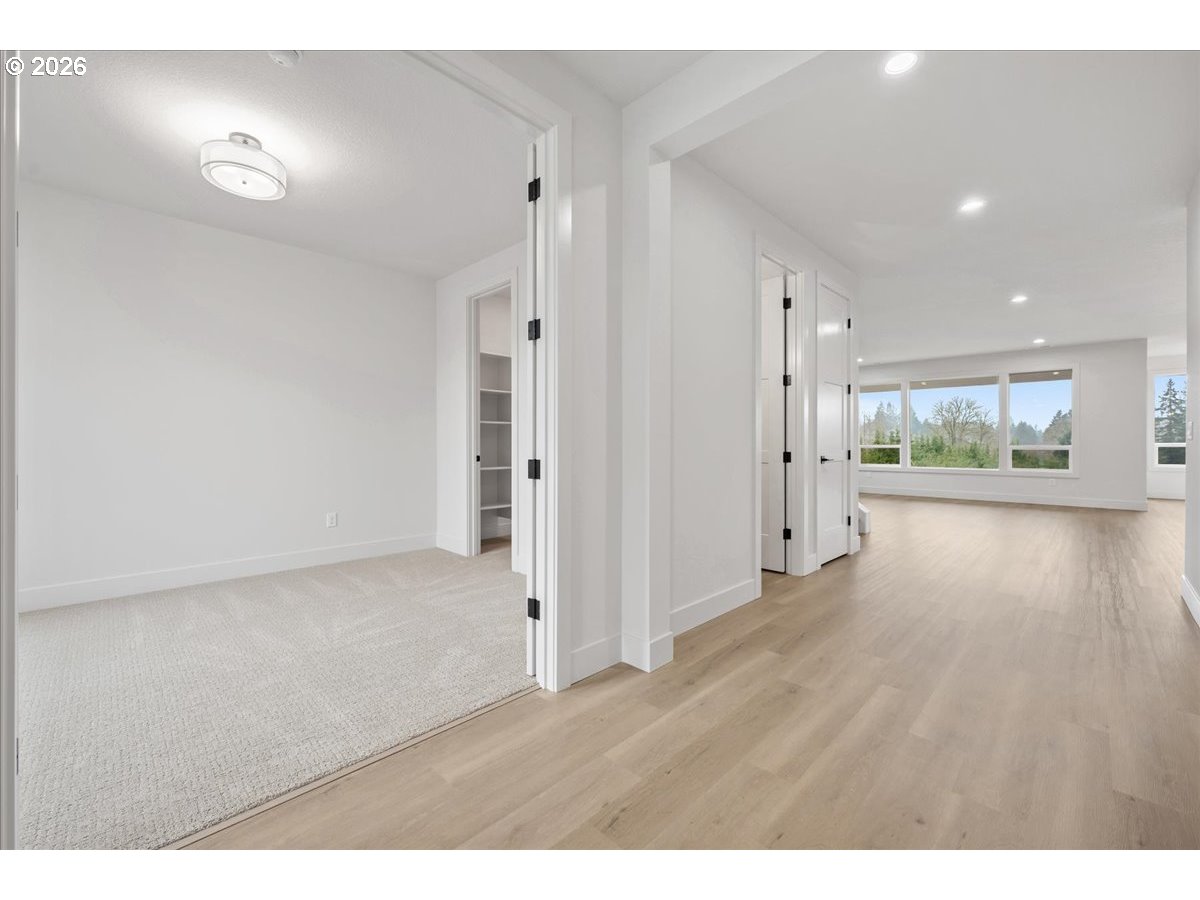 3509 North 11th Circle Ridgefield, WA 98642 - Photo 5 of 43 a view of an empty room and wooden floor