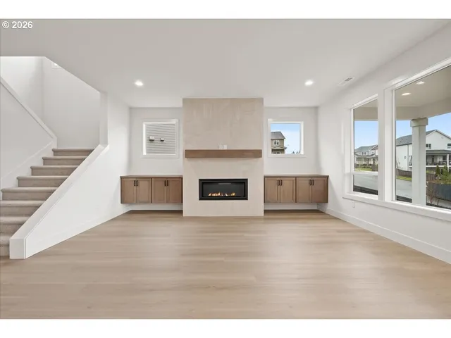 a view of a livingroom with furniture and a fireplace