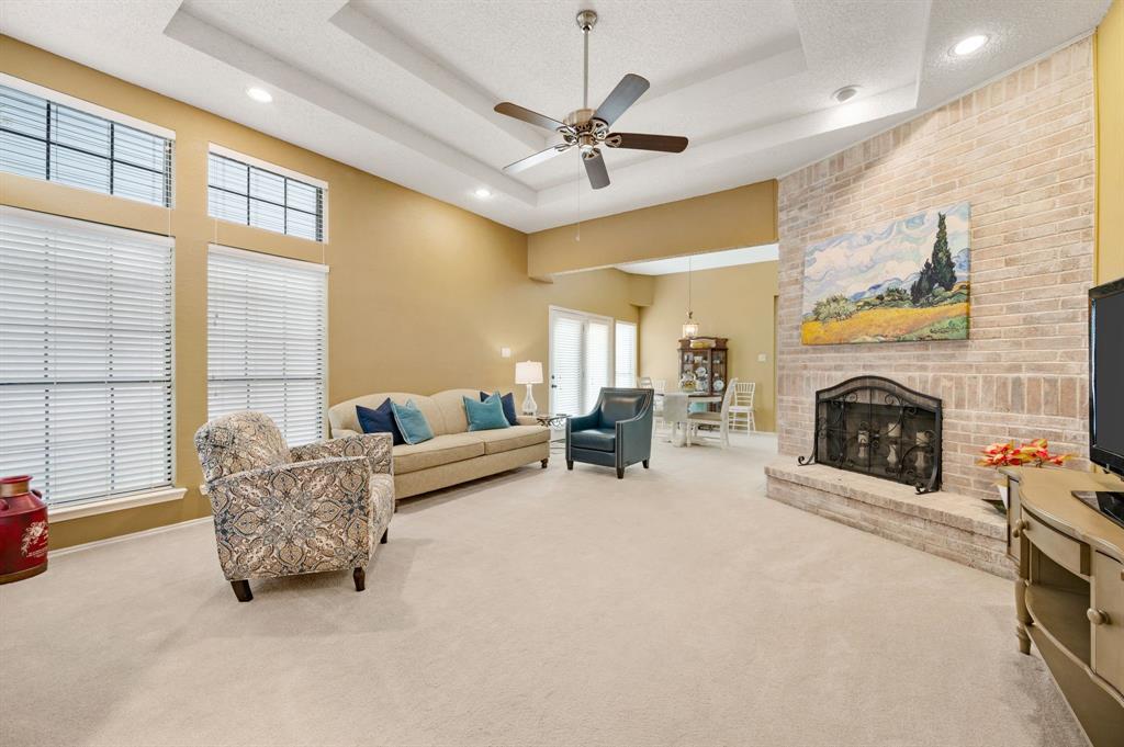 1828 Realistic Court Bedford, TX 76021 - Photo 2 of 16 a living room with furniture and a fireplace