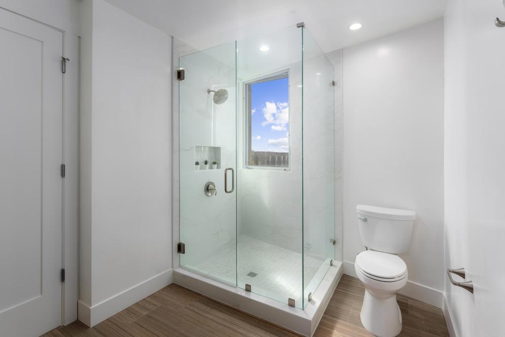 2648 State Street, Unit E Carlsbad, CA 92008 - Photo 16 of 24 a bathroom with a shower toilet and sink