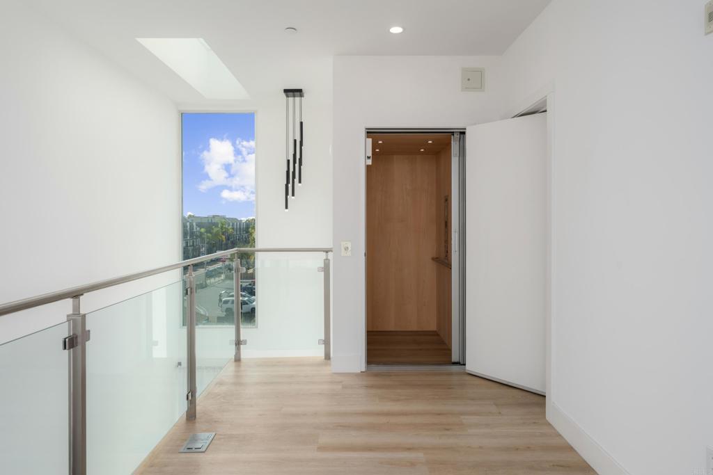 2648 State Street, Unit E Carlsbad, CA 92008 - Photo 18 of 24 a view of entryway with wooden floor